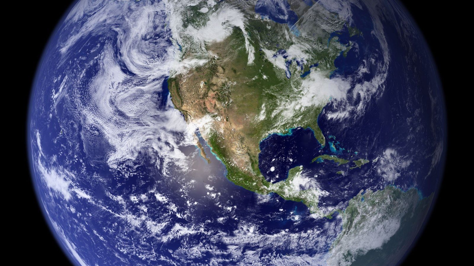 Earth viewed from space, showing blue oceans, green continents, clouds and atmosphere against black space