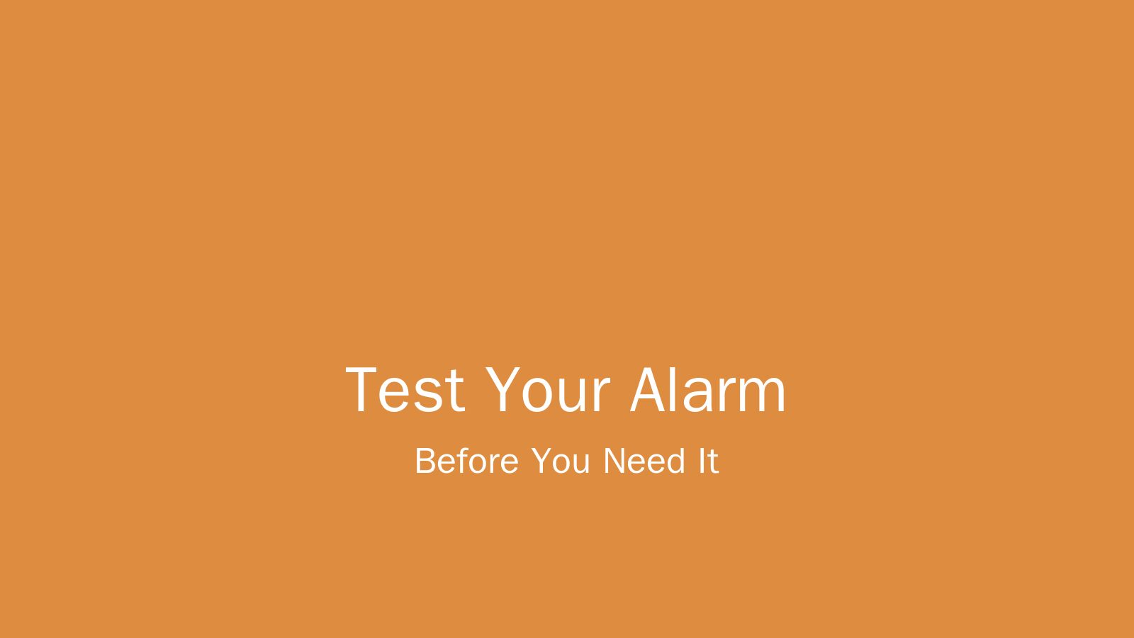 A hand holding an iPhone showing an alarm clock interface on a white bedside table